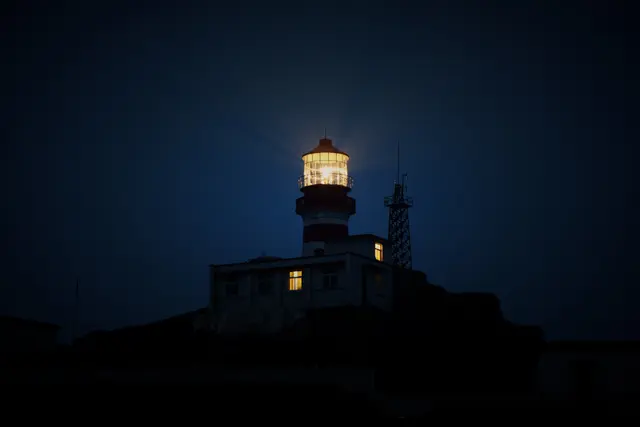 Lighthouse at night (Unsplash).jpg